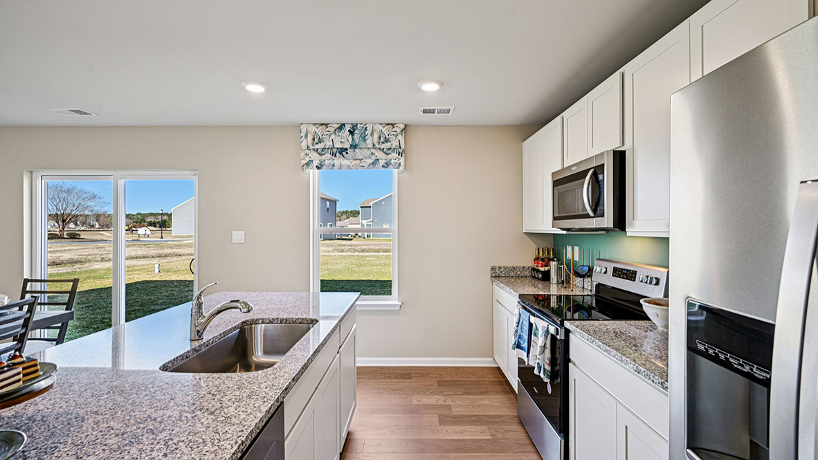The kitchen offers sleek stainless steel appliances.
