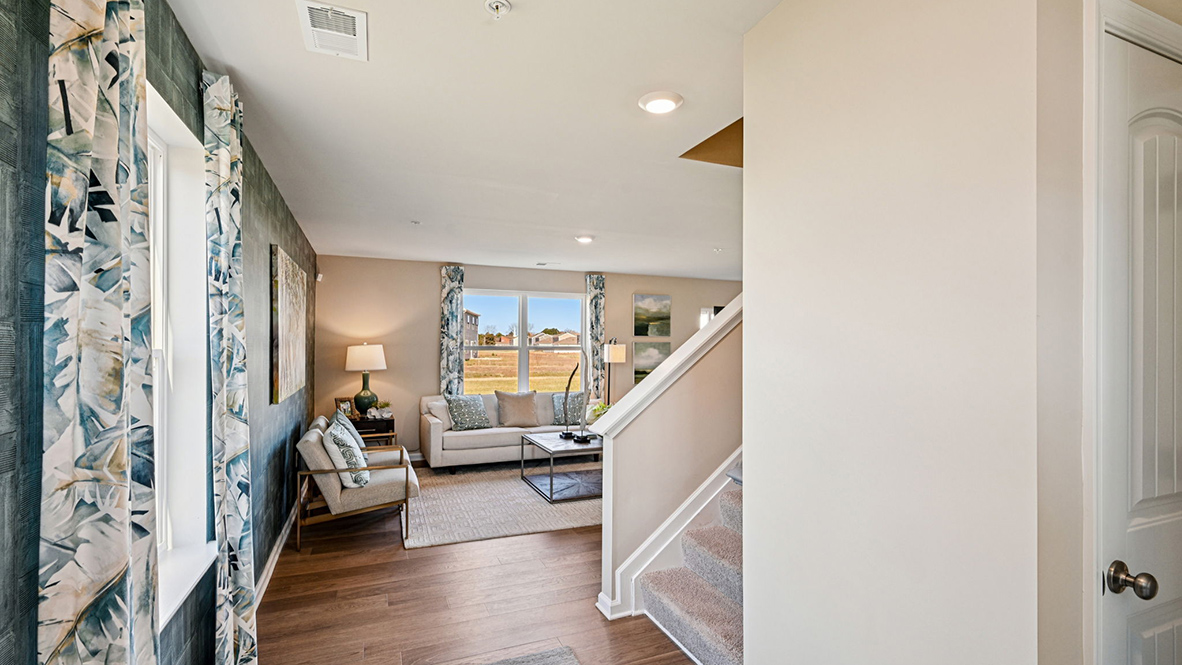 A welcoming foyer with a coat closet greets you as you enter this two-story home.