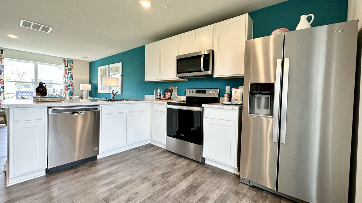 The functional kitchen features stainless steel appliances.