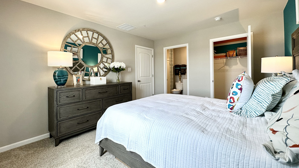 Upstairs, the owner's suite is a quiet retreat featuring a private, full bath with a walk-in shower.