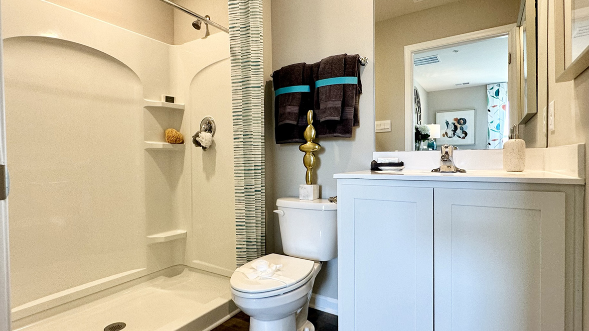 Upstairs, the owner's suite is a quiet retreat featuring a private, full bath with a walk-in shower.