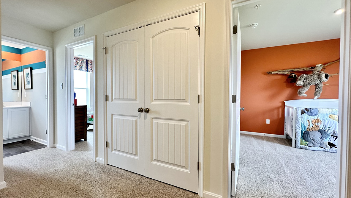 Continuing down the hallway, the two additional well-sized bedrooms each have plenty of closet space.