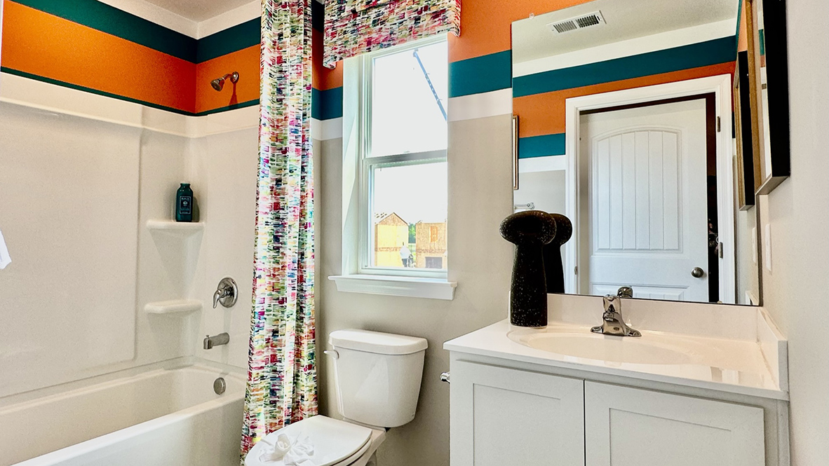 Continuing down the hallway, a hall bathroom and a linen closet are located upstairs.