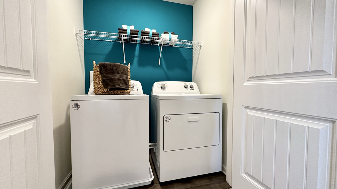 The convenient upstairs laundry closet comes complete with a full-size washer and dryer.