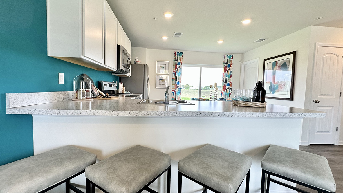 The functional kitchen features an L-shaped counter.