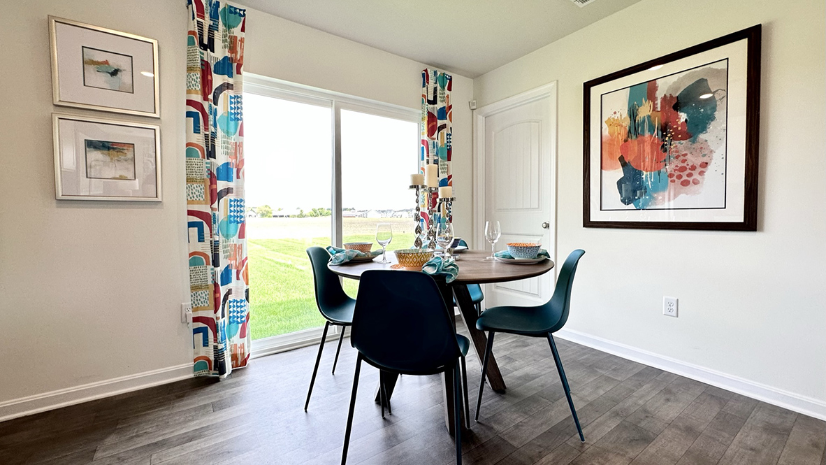 The functional kitchen features a sliding glass door for easy access to the backyard.