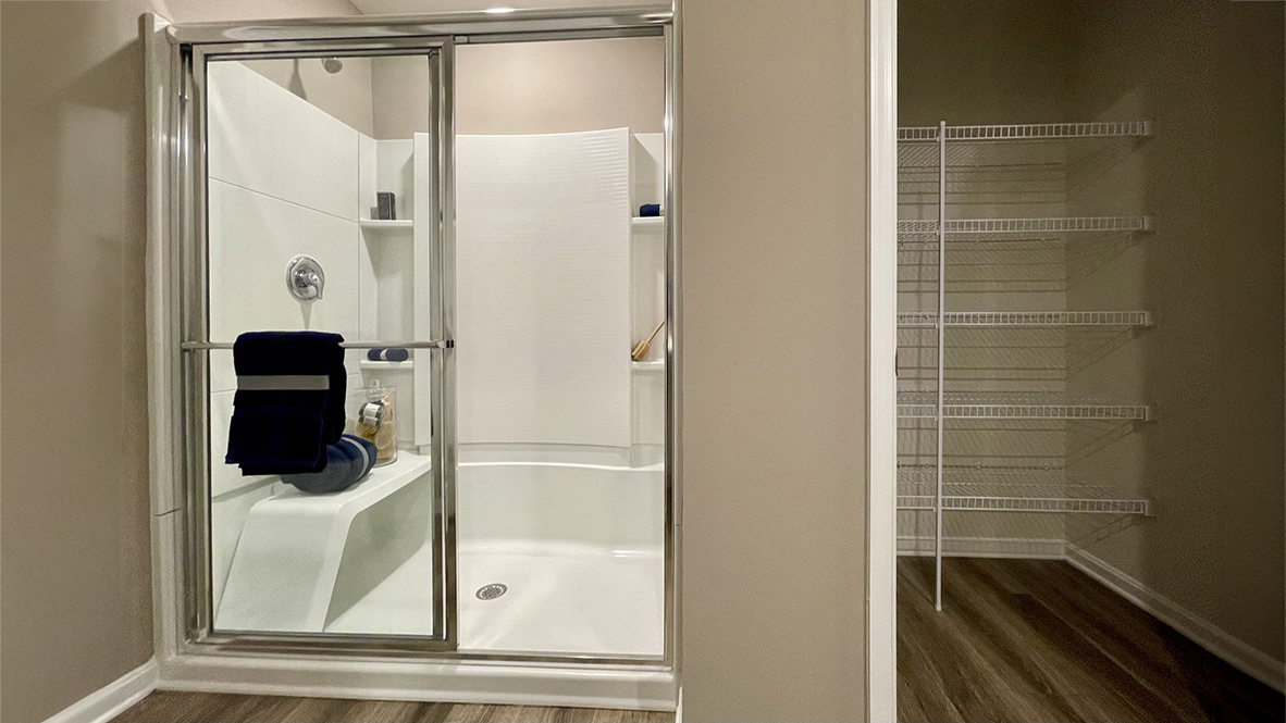 The oversized owner’s bathroom has a walk-in shower and a linen closet.
