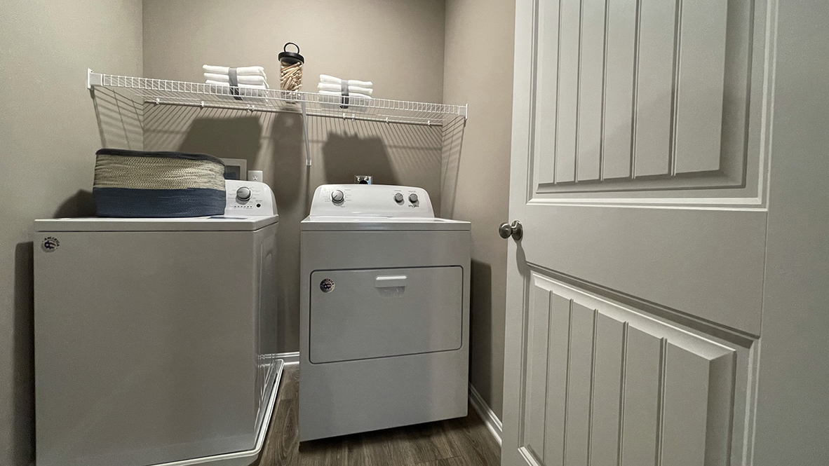 The upstairs laundry room comes complete with washer and dryer.