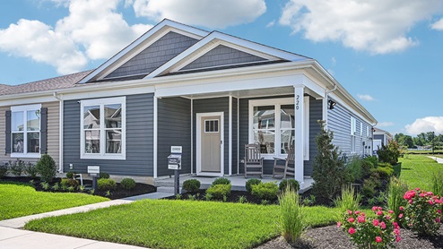 Eden Hill Brandywine model home with blue siding and yellow front door.