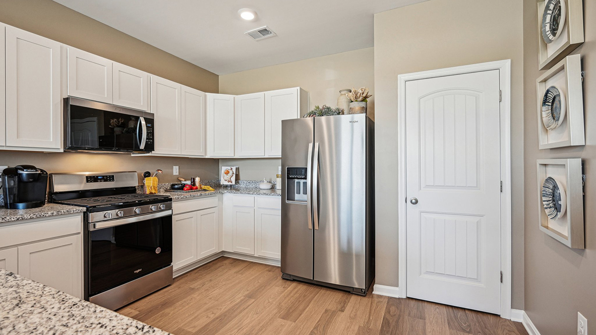 The heart of the home is the well-equipped kitchen, complete with a large pantry.