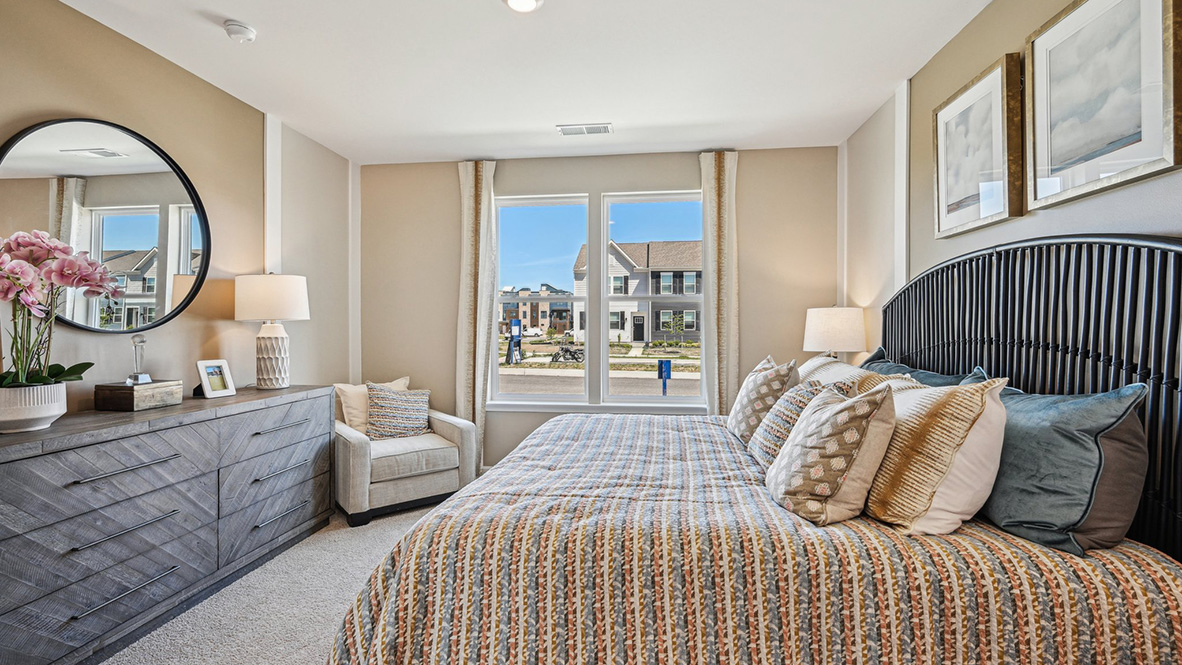 The private owner’s suite, conveniently located near the front of the home, offers a serene retreat.