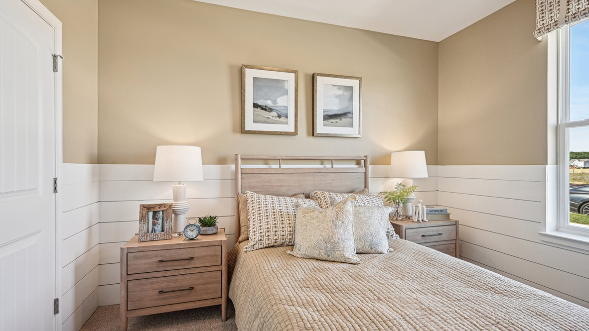 Just off the great room and kitchen, the second bedroom provides a flexible space.