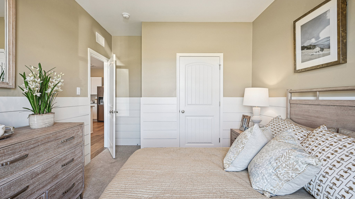 Just off the great room and kitchen, the second bedroom provides a flexible space.