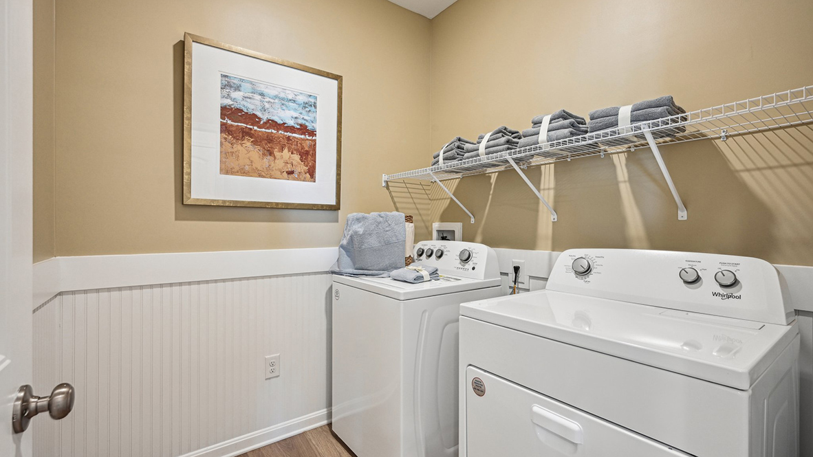 Down the hallway, you’ll find a convenient laundry room.