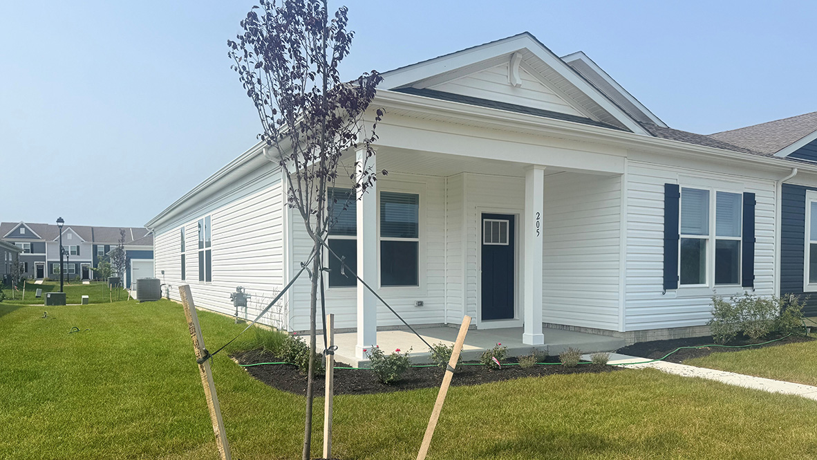 A Brandywine villa home with a large front porch.