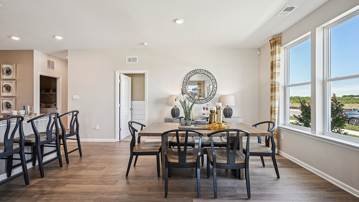The great room seamlessly flows into the kitchen, creating a perfect space for entertaining guests or enjoying family time.