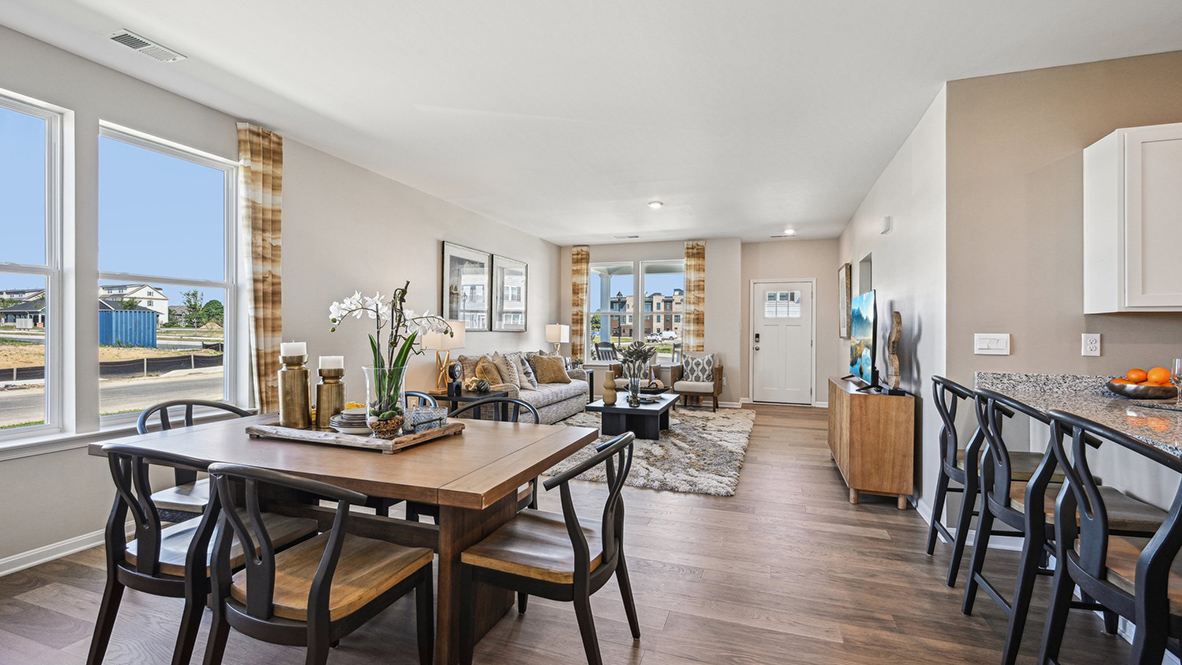 Large windows fill the living room with natural light.