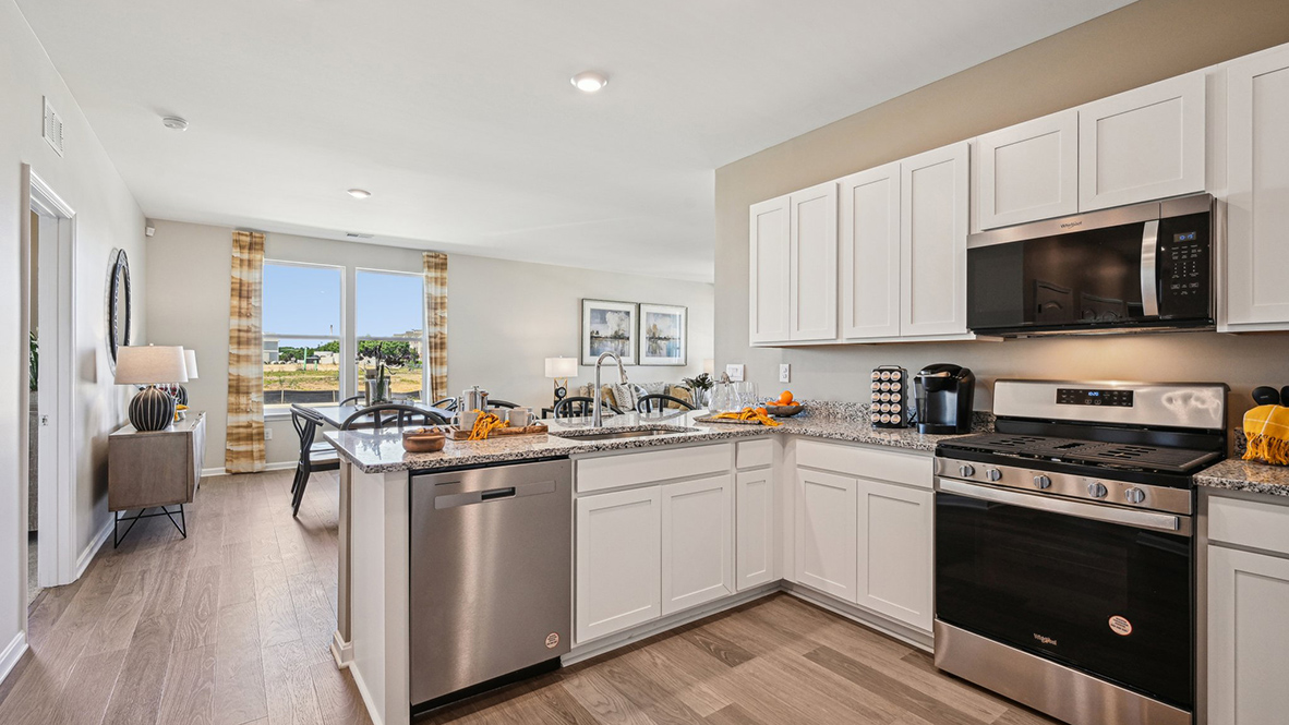The heart of the home is the well-equipped kitchen, complete with a peninsula island.