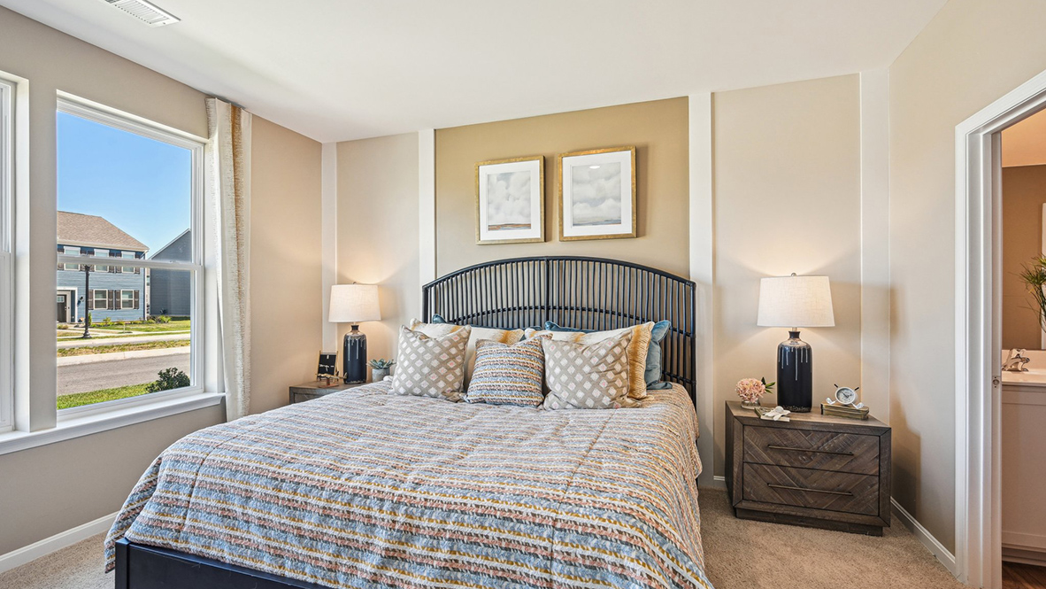 The private owner’s suite, conveniently located near the front of the home, offers a serene retreat.