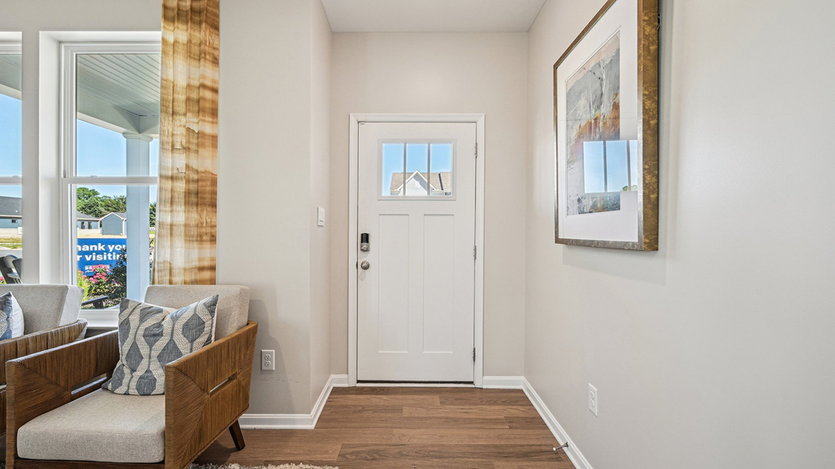 You’re welcomed into a bright and expansive great room.