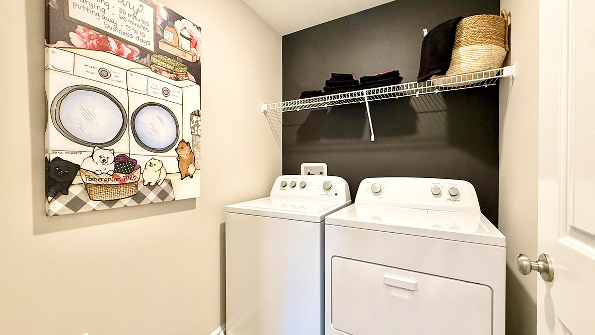 A tucked-away hallway leads to the laundry room, keeping everyday essentials neatly organized.