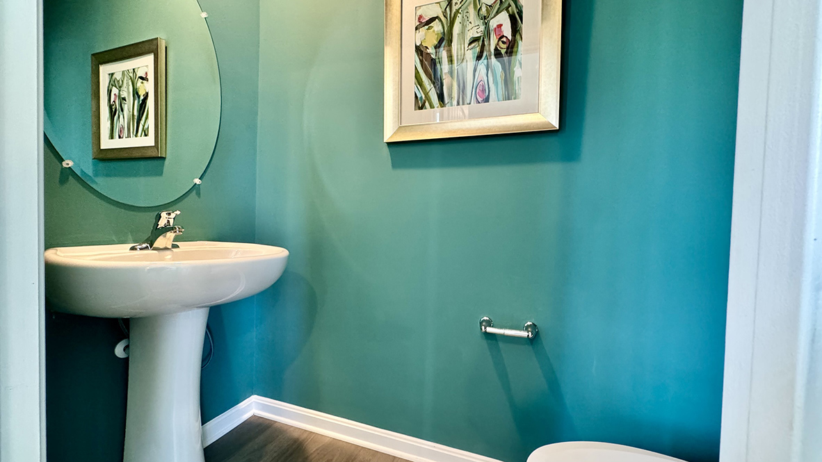 A powder room is off the dining area.