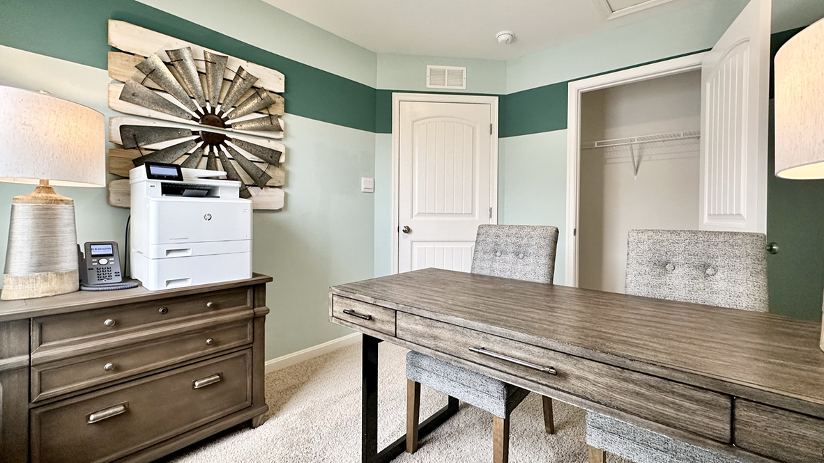 This office/bedroom has plenty of room for all your furniture.