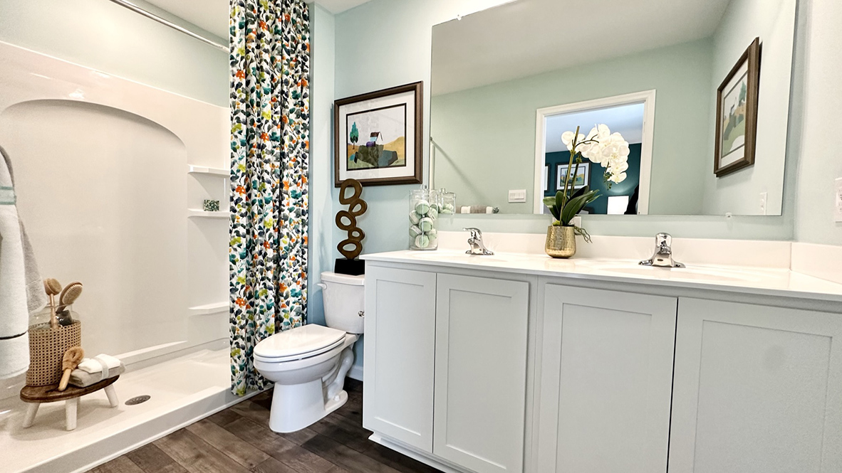 Primary bathroom with double bowl vanity.