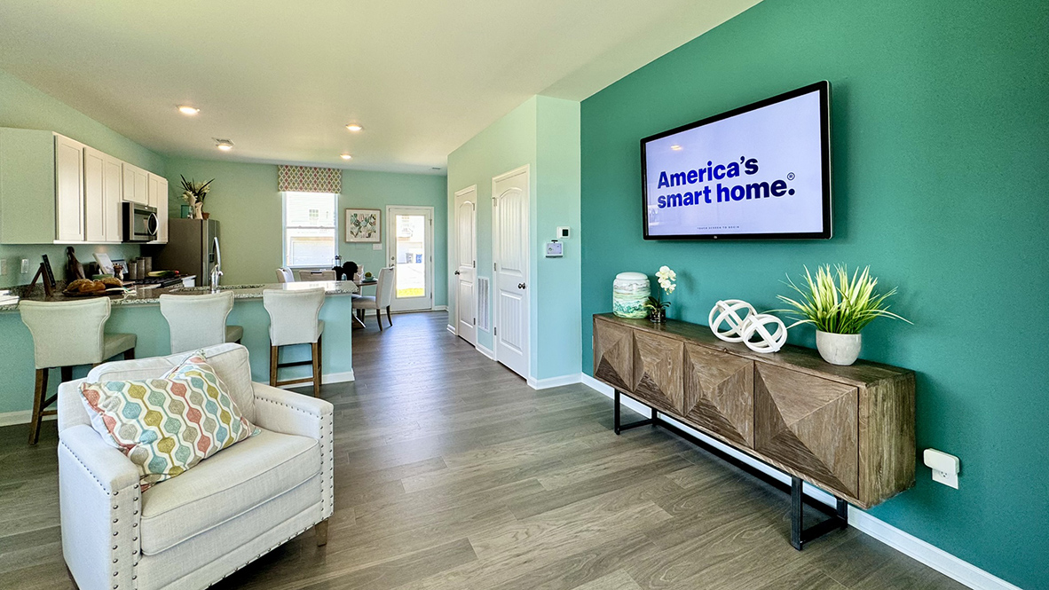 The living area flows into the kitchen and dining area.