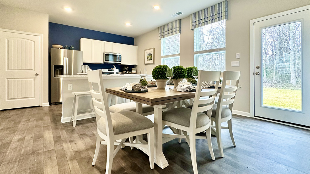 The dining area, kitchen and expansive living room are all open.