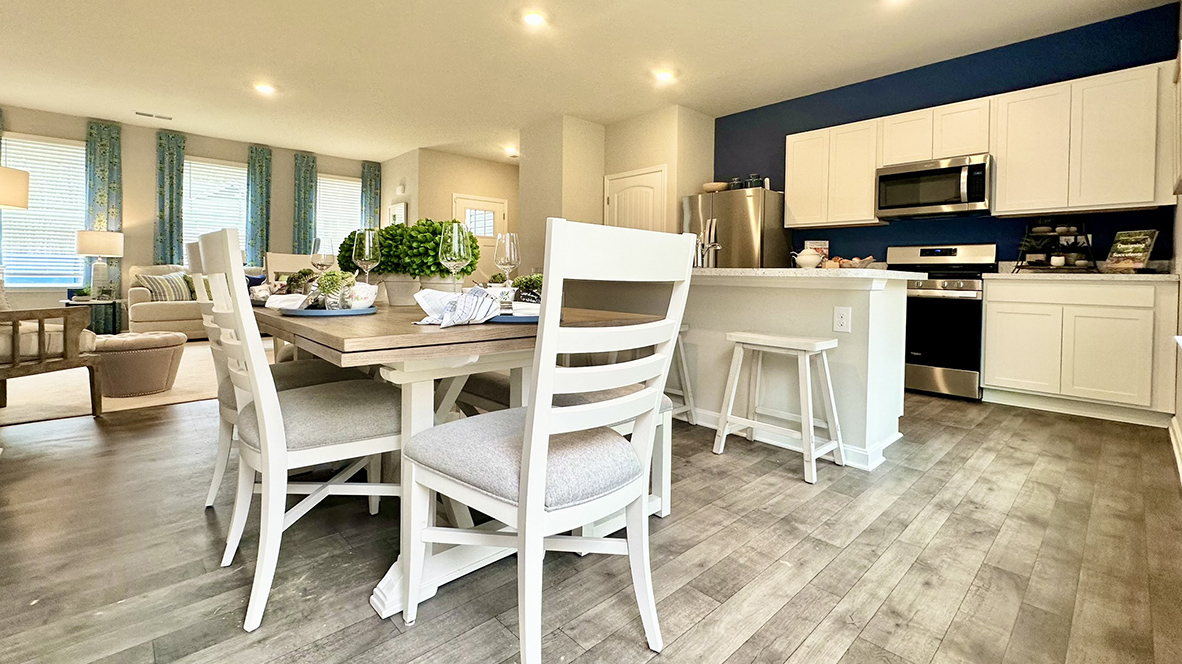 The dining area, kitchen and expansive living room opens into the dynamic open floor plan.