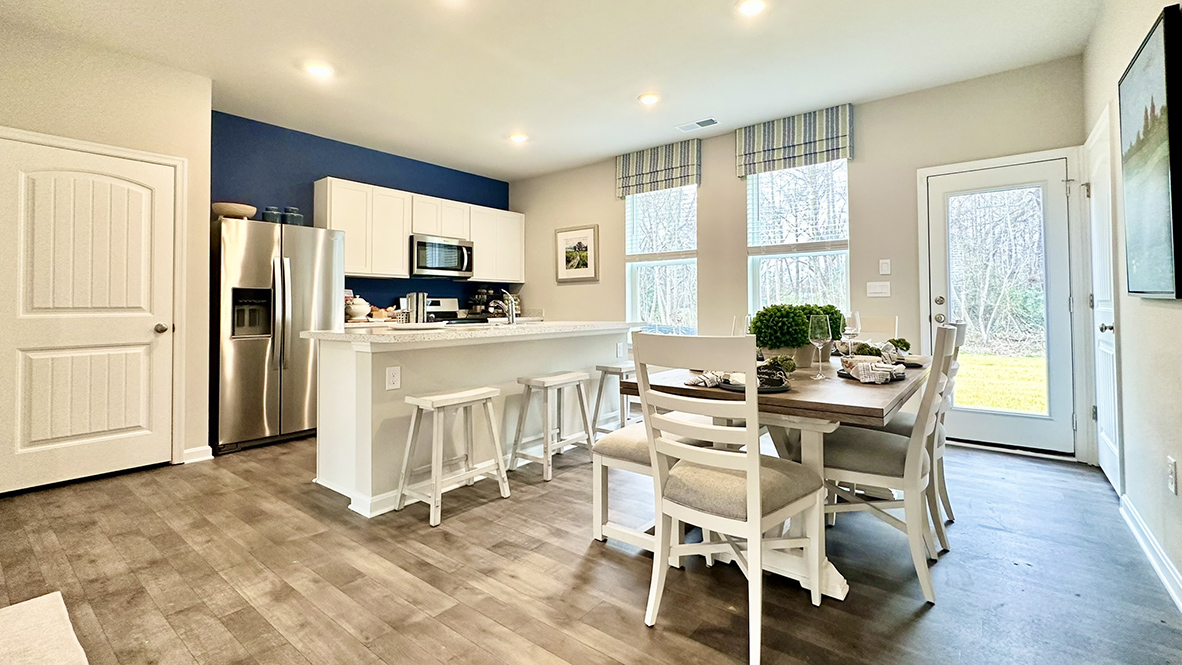 The home's well-designed eat-in kitchen gives access to the backyard.