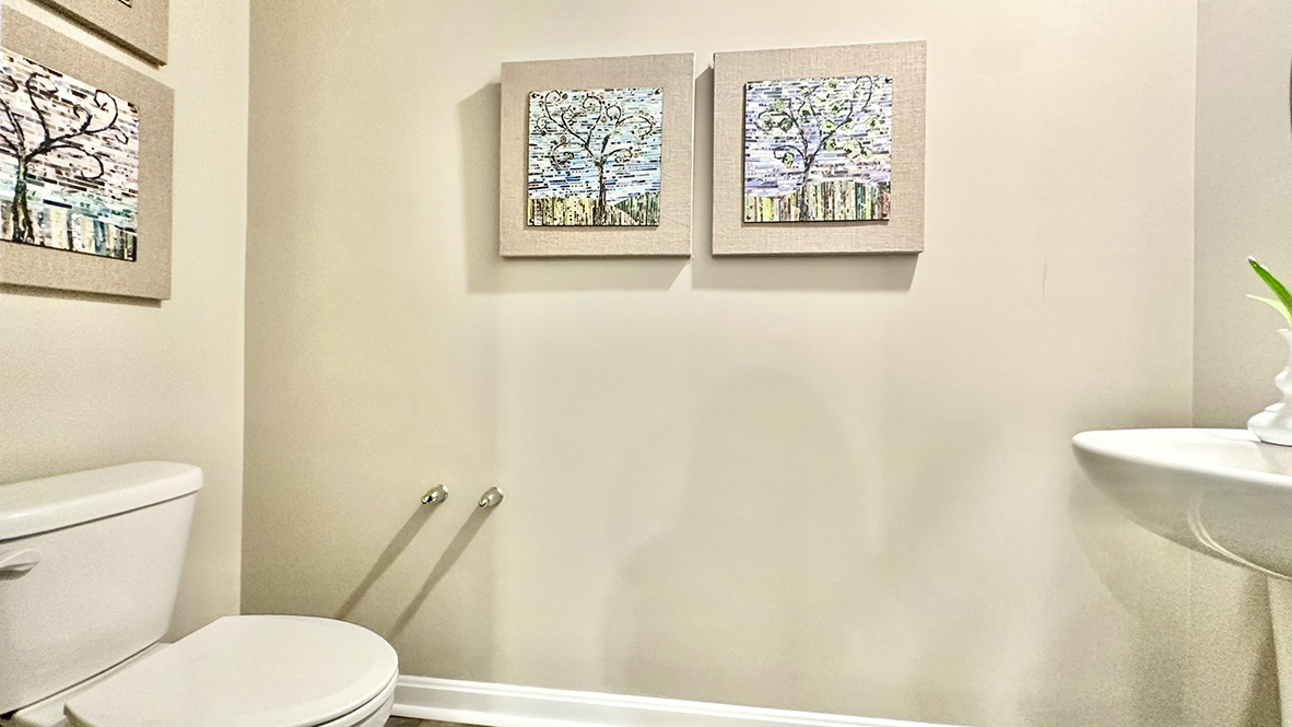 The first-floor powder room is tucked off the kitchen.