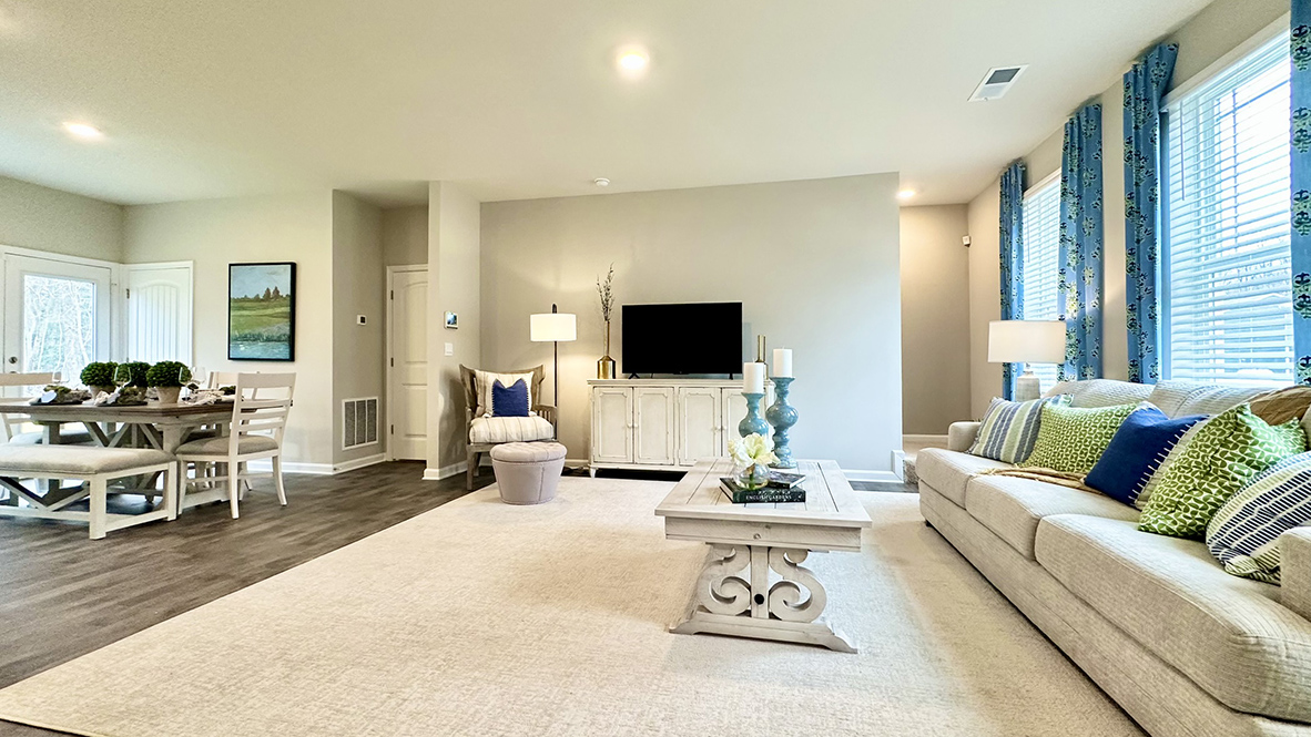 The dining area, kitchen and expansive living room are all open.