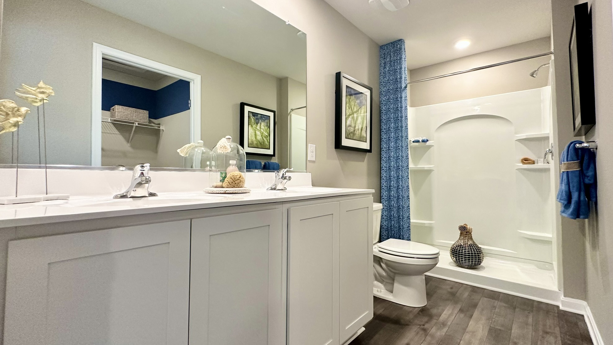 Upstairs, the first bedroom is complete with a full bathroom and walk-in closet.