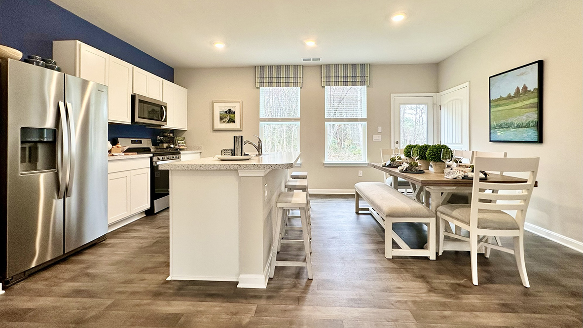 The dining area, kitchen and expansive living room are all open.