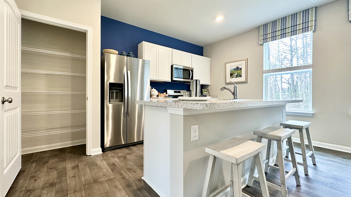 The home's well-designed eat-in kitchen boasts a pantry closet.