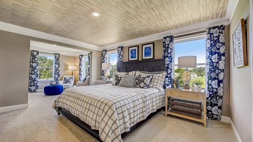The primary bedroom offers a sitting room.