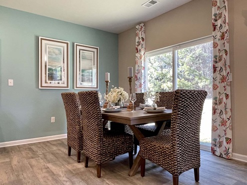 The dining area is next to the back sliding glass door.