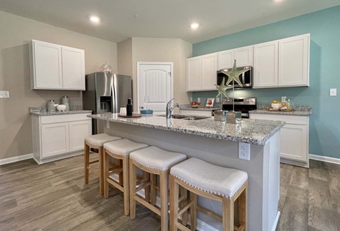 Open-concept kitchen with a large island with room for seating.