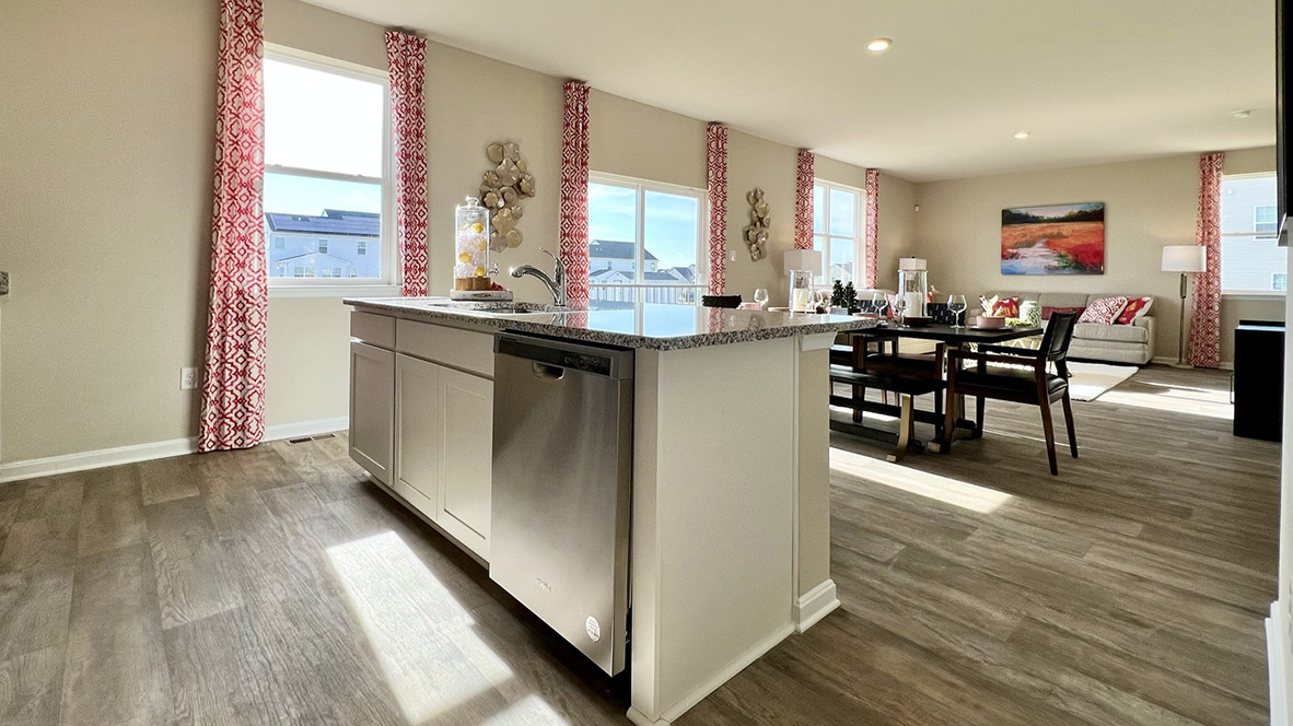The well-designed gourmet kitchen features beautiful quartz countertops.