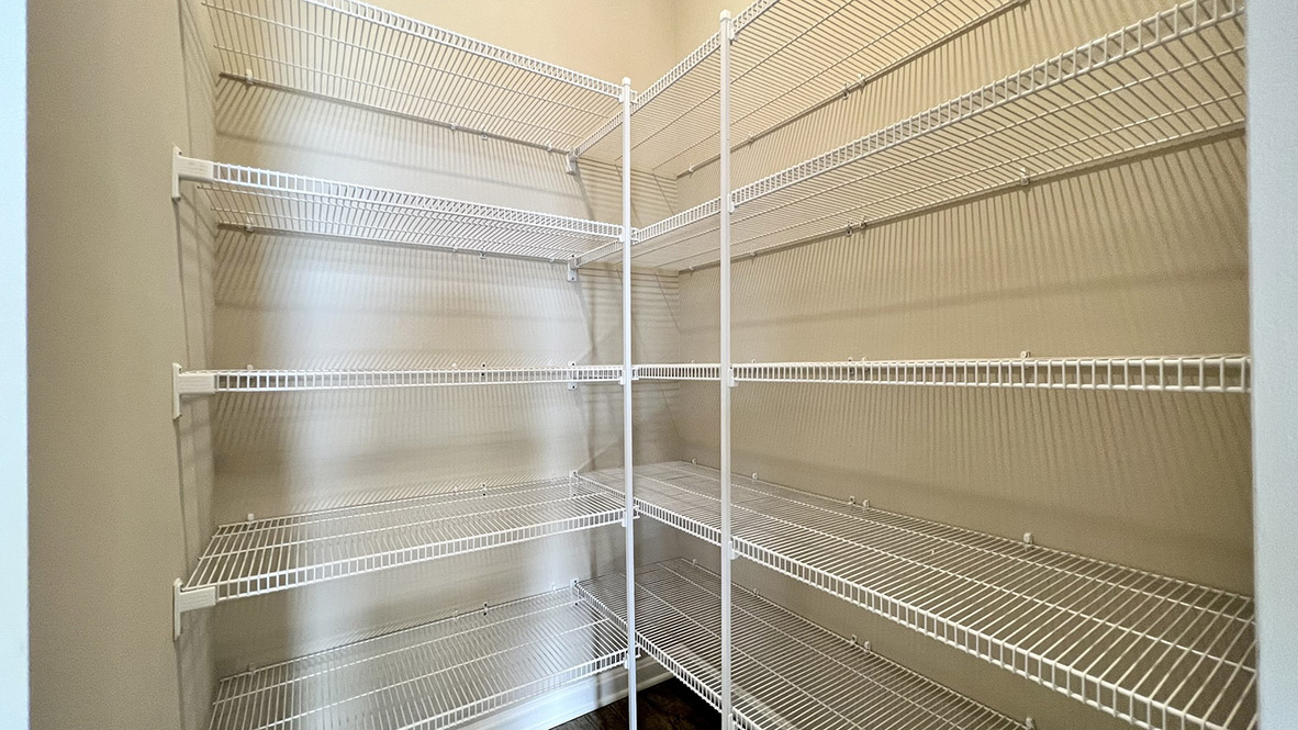 The well-designed gourmet kitchen features an oversized corner pantry.