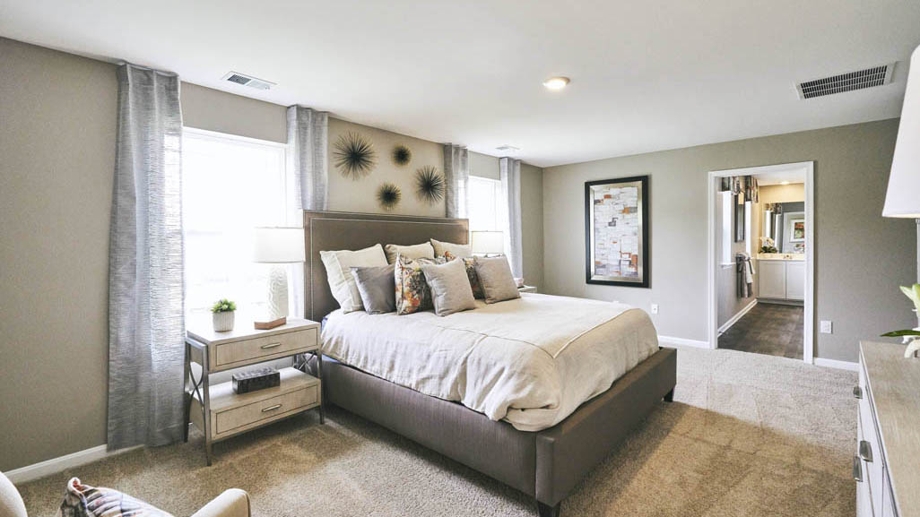 The impressive owner’s suite boasts an expansive bedroom and a contemporary owner’s bathroom.