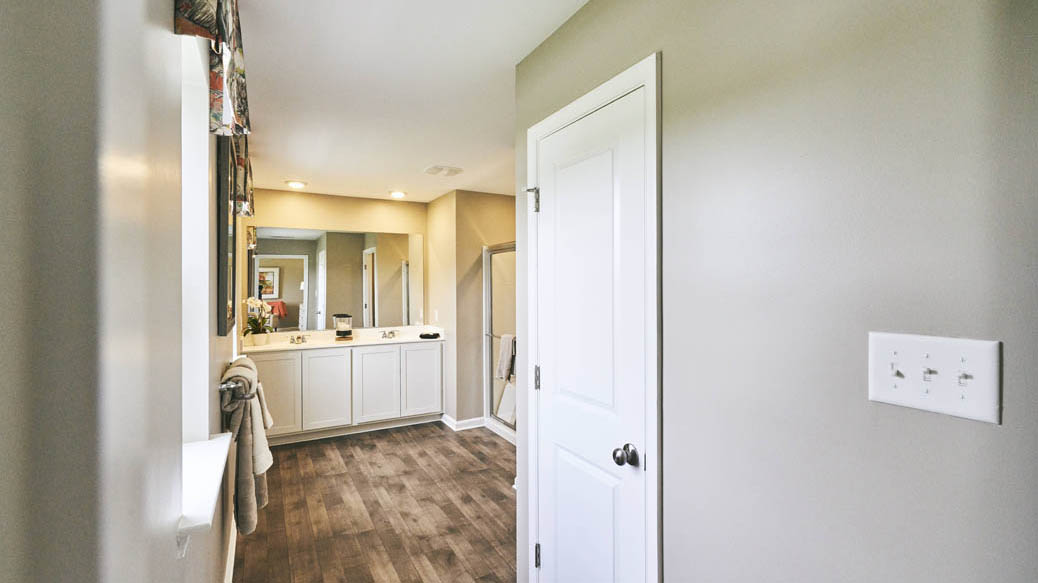 The impressive owner’s suite boasts an expansive bedroom and a contemporary owner’s bathroom.