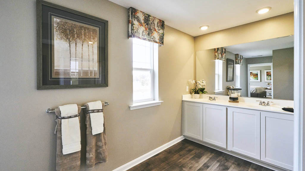 The impressive owner’s suite boasts an expansive bedroom and a contemporary owner’s bathroom.