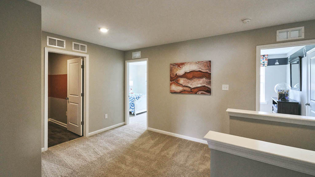 As you make your way up the stairs that are nestled in the corner of the great room you will find a vast landing.