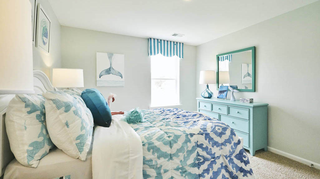 Three generously sized secondary bedrooms, and a spacious hall bathroom with double vanity complete the upstairs.