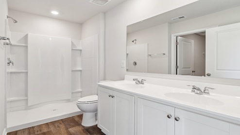 The private bathroom has a double bowl vanity.