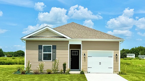 An Helena one story home with tan siding and a one-car garage.