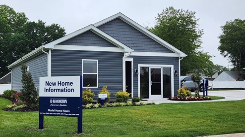 Kinnamon Meadows model Sullivan home with blue siding and a one-car garage.